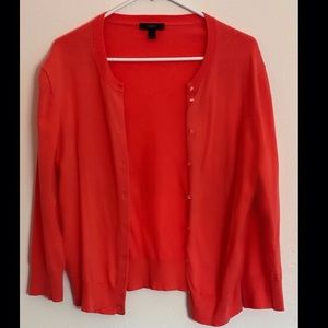 Pretty orange J.CREW cardigan in the size large.